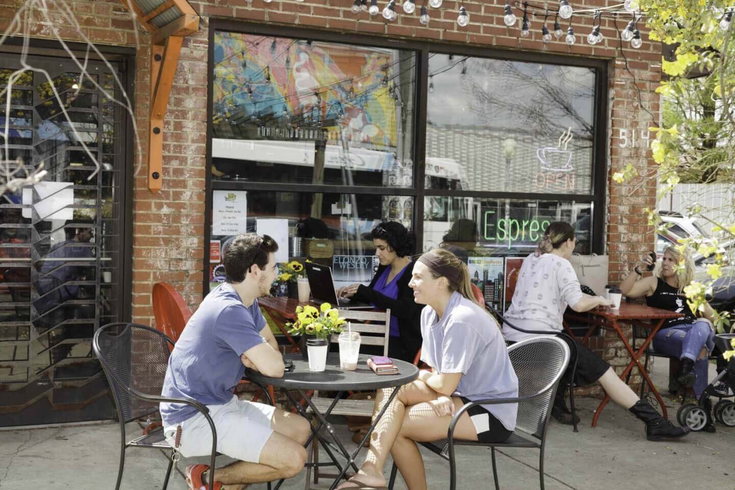 two people dining near the henry noda apartments